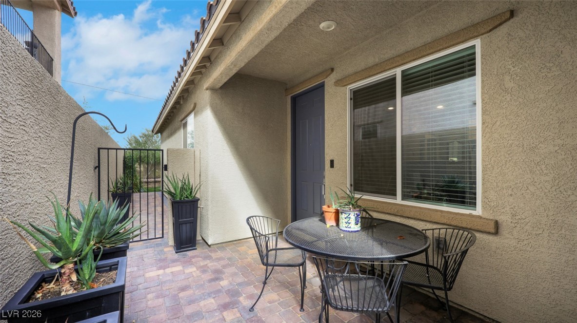 1094 Langston Ranch Avenue Henderson, NV 89002 - Photo 58 of 70 View of patio / terrace with a gate and outdoor dining space