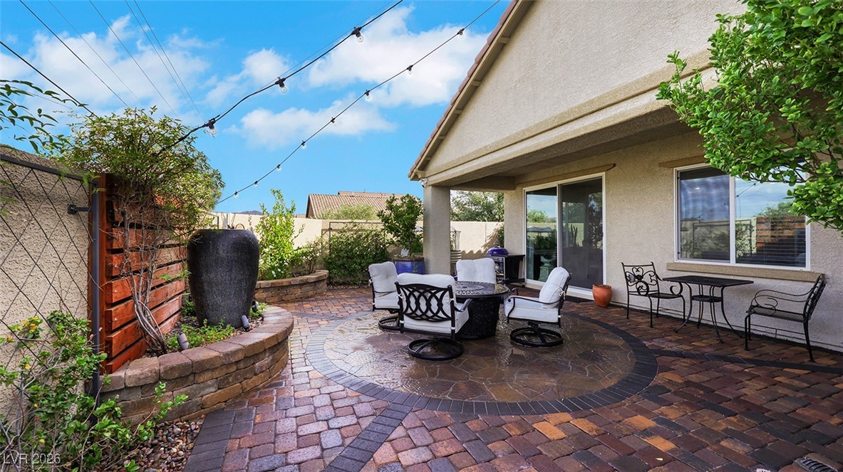 1094 Langston Ranch Avenue Henderson, NV 89002 - Photo 6 of 70 Fenced backyard with a patio and outdoor dining space