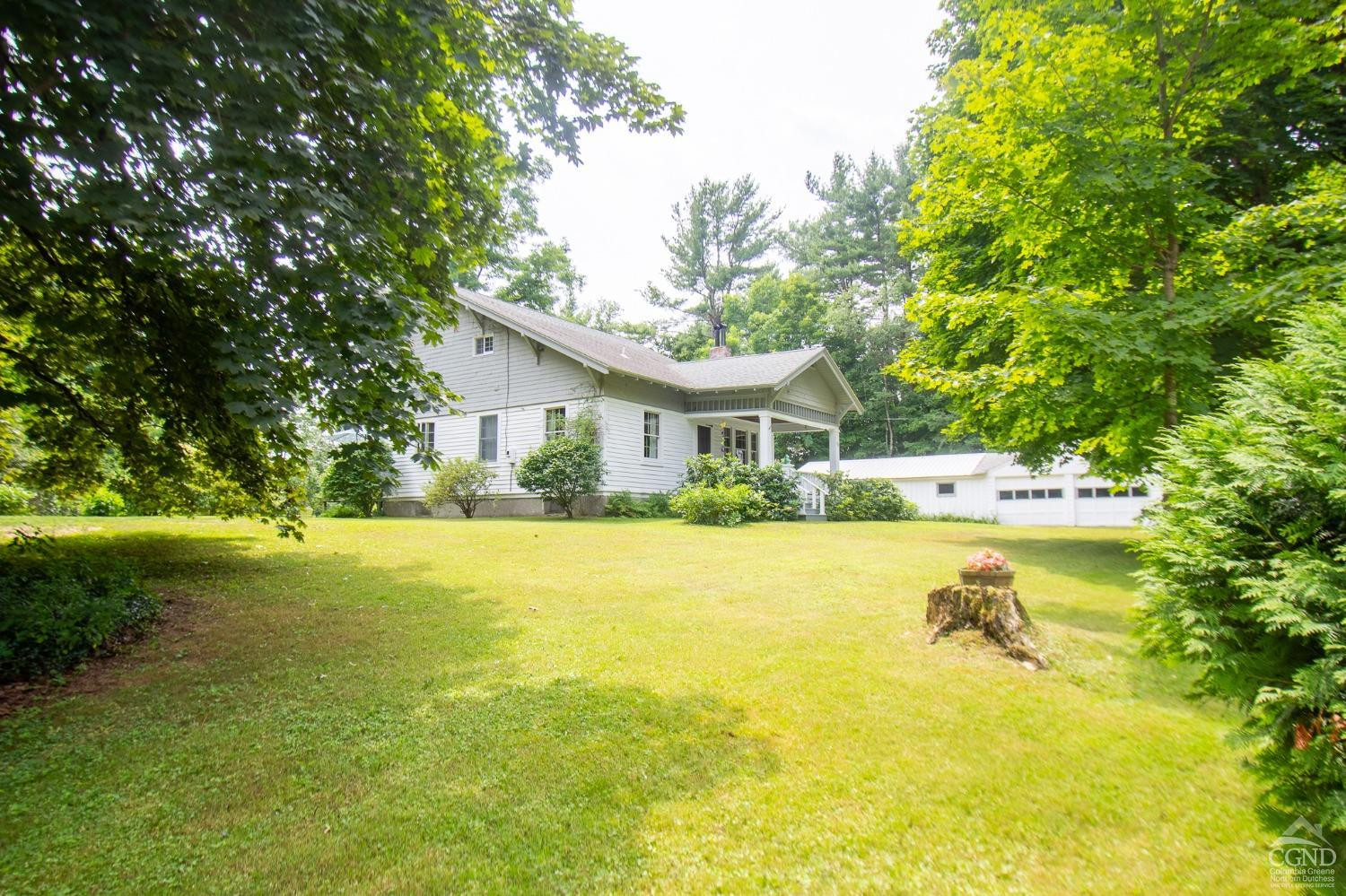 156 Upper Queechy Road Canaan, NY 12029 - Photo 1 of 19 a house with swimming pool in front of it