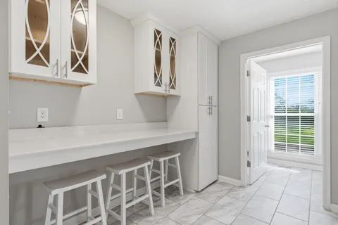 a view of an entryway with wooden floor