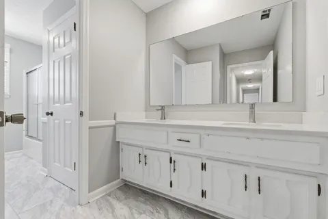 a bathroom with a window and a toilet