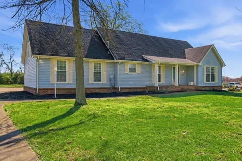 front view of a house with a yard
