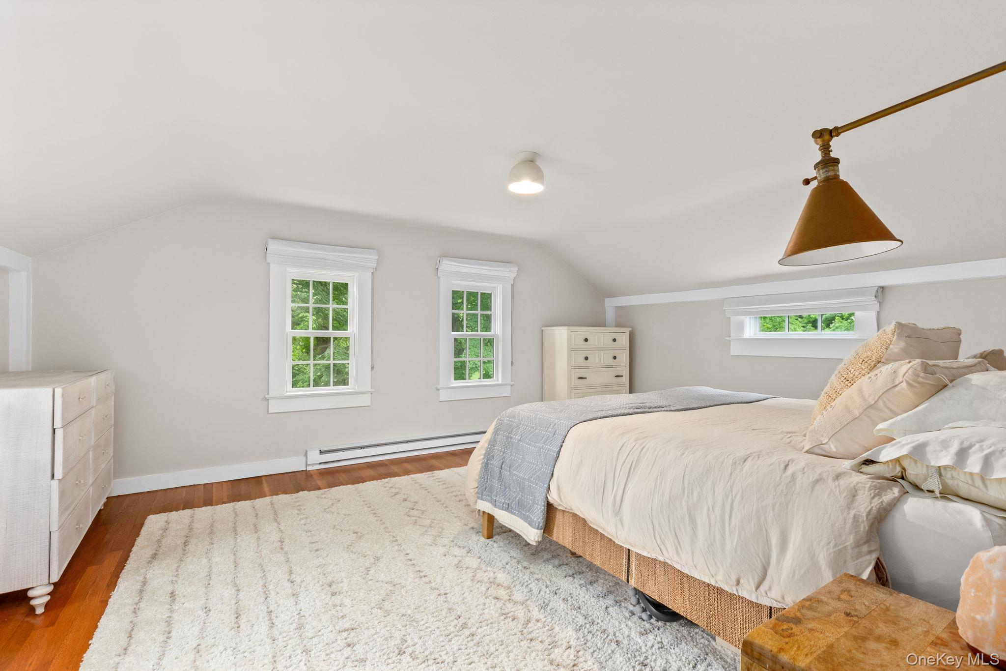 23 Pound Ridge Road Pound Ridge, NY 10576 - Photo 22 of 40 a bedroom with a bed and a window