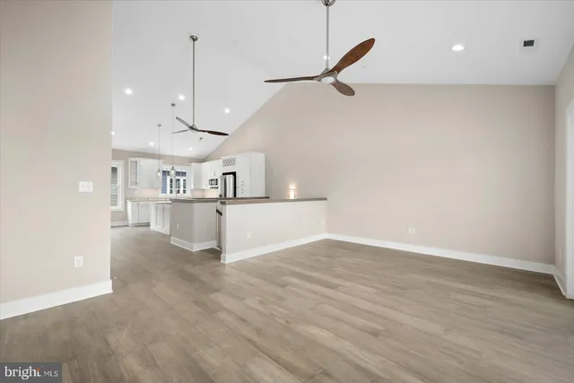 a view of a kitchen with a sink and cabinets