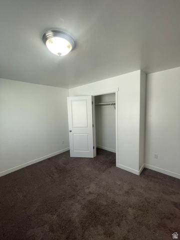 14760 Rising Star Way, Unit 71 Bluffdale, UT 84065 - Photo 37 of 41 Plush brown carpeting, white walls, and a ceiling-mounted light fixture