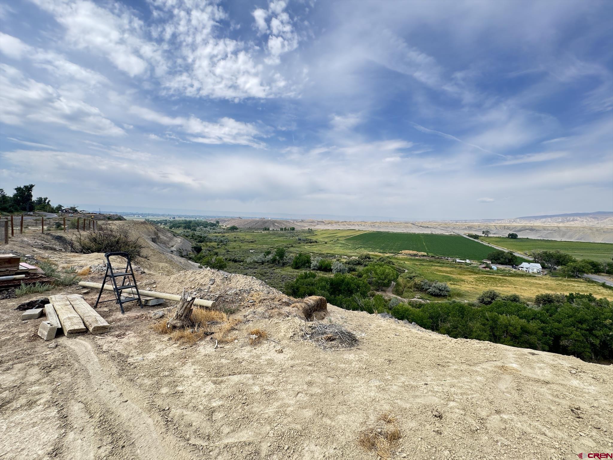 9159 Highway 65 Austin, CO 81410 - Photo 24 of 33 a view of a lake with a yard