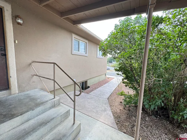 a house view with a backyard space