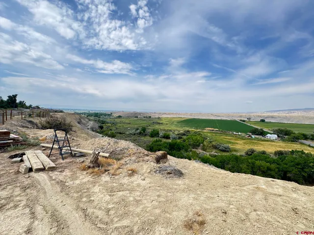 a view of a lake with a yard