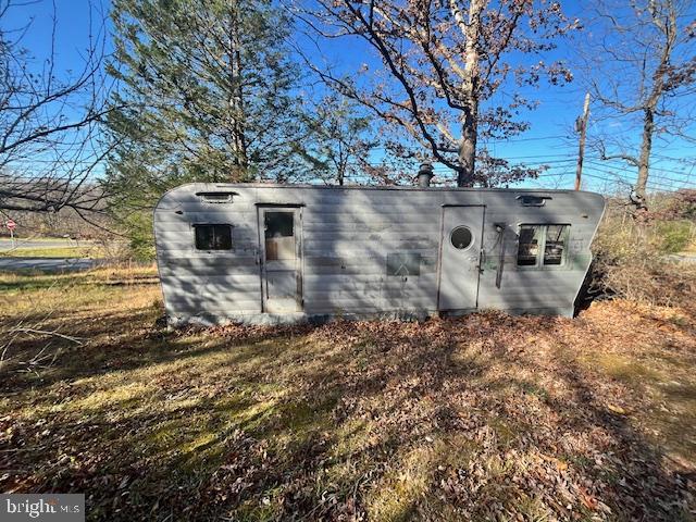 852 Cedar Grove Road Winchester, VA 22603 - Photo 18 of 21 a view of a backyard with wooden fence and large trees