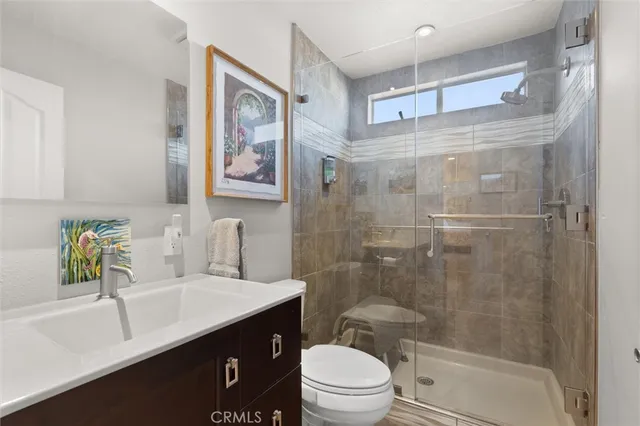 a bedroom with two beds and painting on the wall