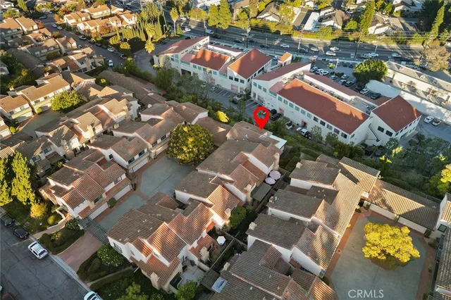 an aerial view of residential houses with outdoor space