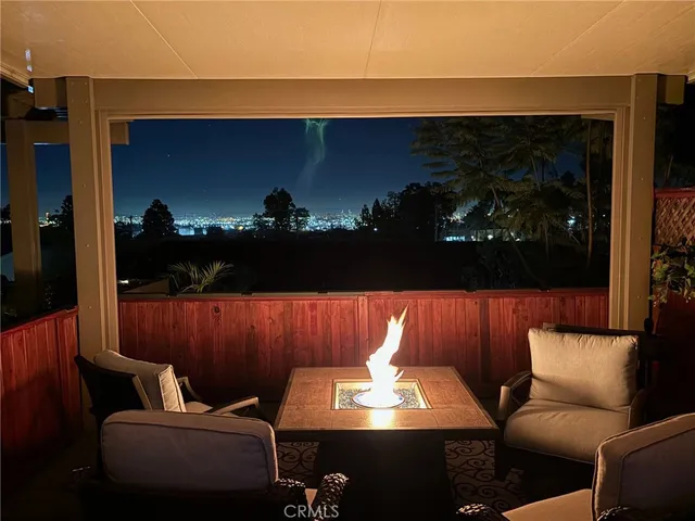 a view of a chairs and table in a patio