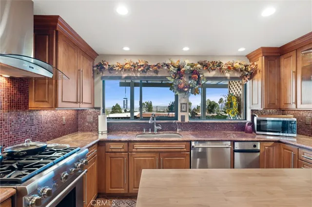 a kitchen with a sink and a refrigerator