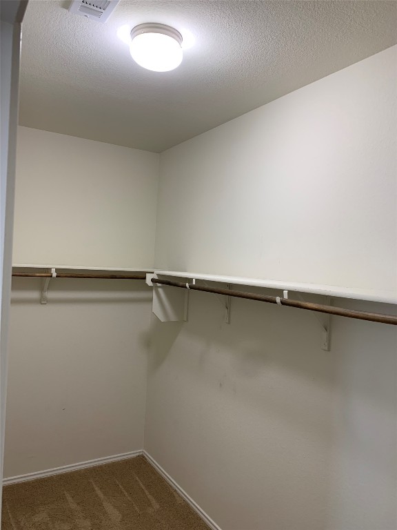 113 Sierra Mar Loop Leander, TX 78641 - Photo 14 of 22 a view of a room with racks on the wall