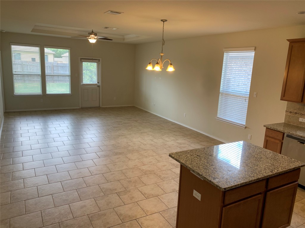 113 Sierra Mar Loop Leander, TX 78641 - Photo 8 of 22 a view of a kitchen with a sink and chandelier