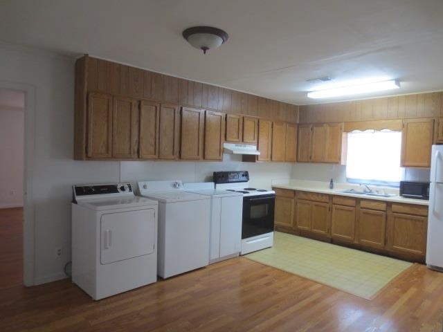 6386 Highway 209 Ripley, TN 38063 - Photo 18 of 23 a kitchen with a sink stove and cabinets