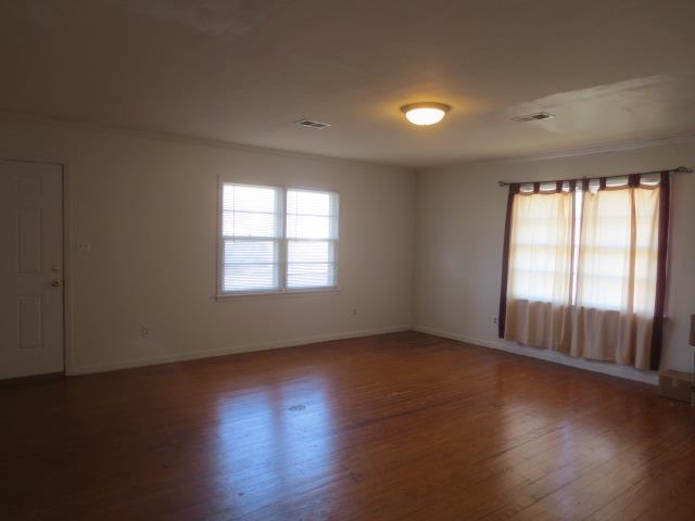 6386 Highway 209 Ripley, TN 38063 - Photo 20 of 23 an empty room with wooden floor and windows