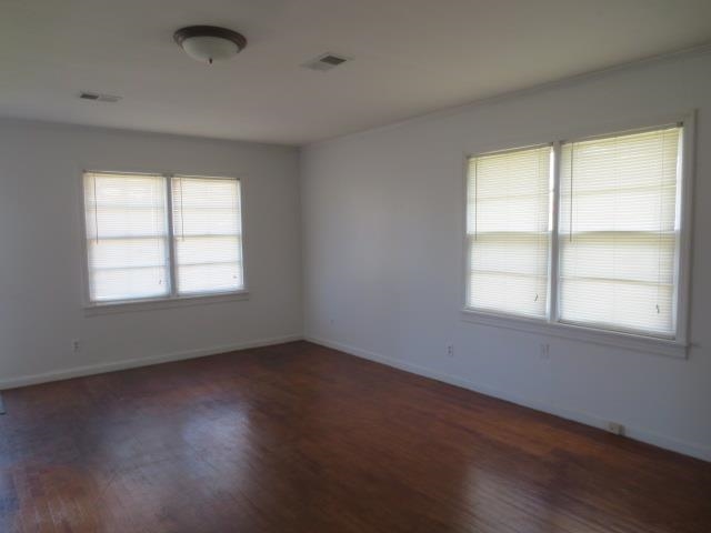 6386 Highway 209 Ripley, TN 38063 - Photo 22 of 23 an empty room with wooden floor and windows