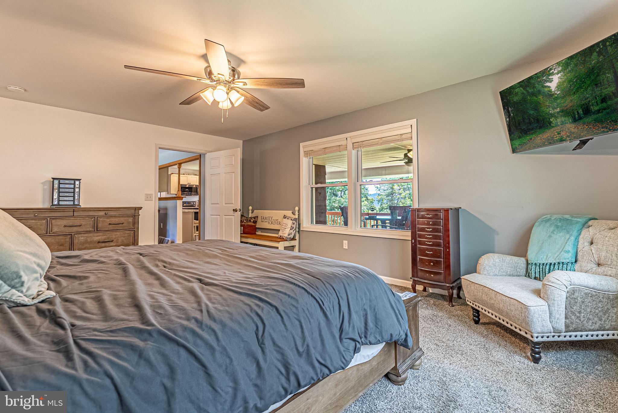 14608 Brant Road Southwest Cresaptown, MD 21502 - Photo 11 of 40 a bedroom with a bed couch and a flat tv screen