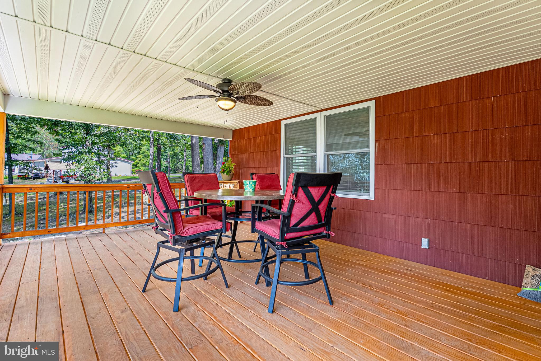 14608 Brant Road Southwest Cresaptown, MD 21502 - Photo 3 of 40 a view of a roof deck with table and chairs and wooden floor