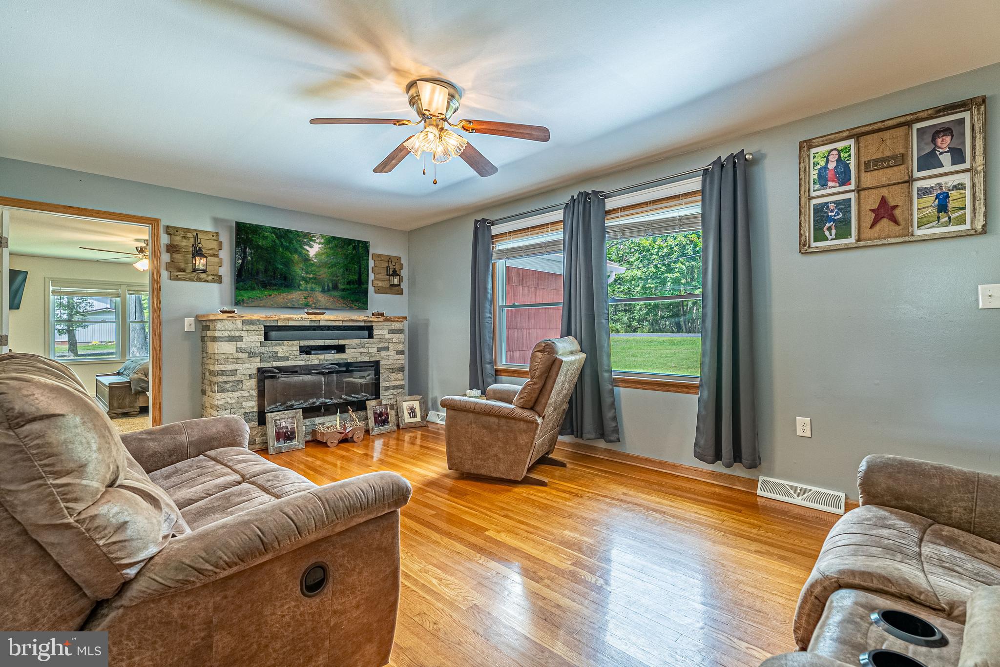14608 Brant Road Southwest Cresaptown, MD 21502 - Photo 6 of 40 a living room with furniture and a flat screen tv