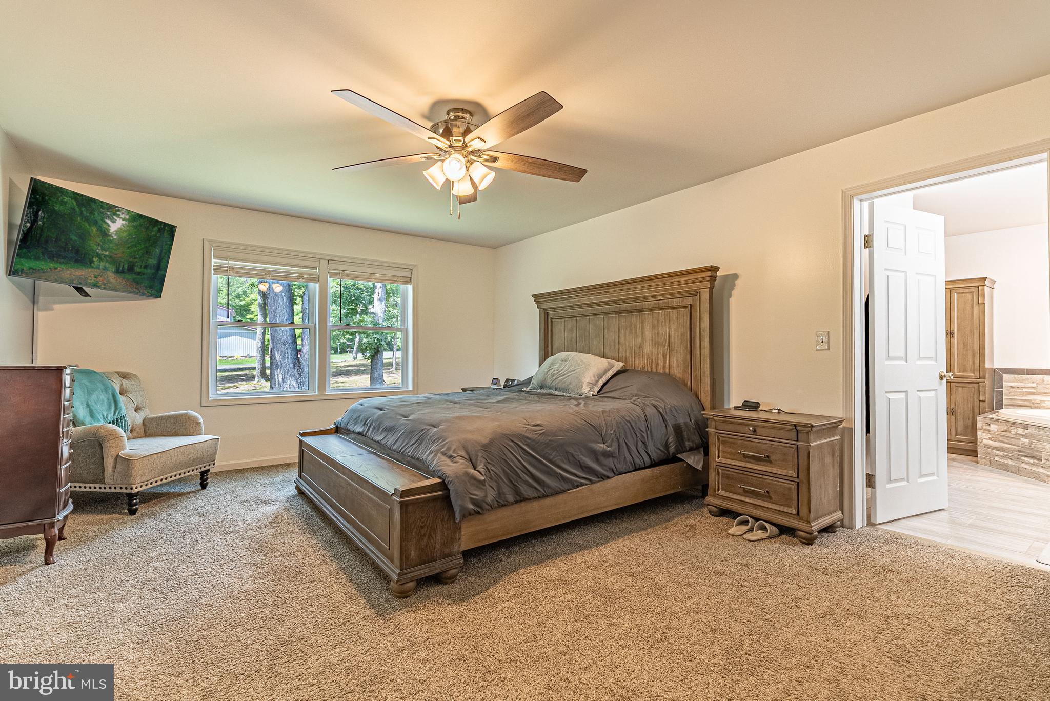 14608 Brant Road Southwest Cresaptown, MD 21502 - Photo 10 of 40 a spacious bedroom with a bed and glass window