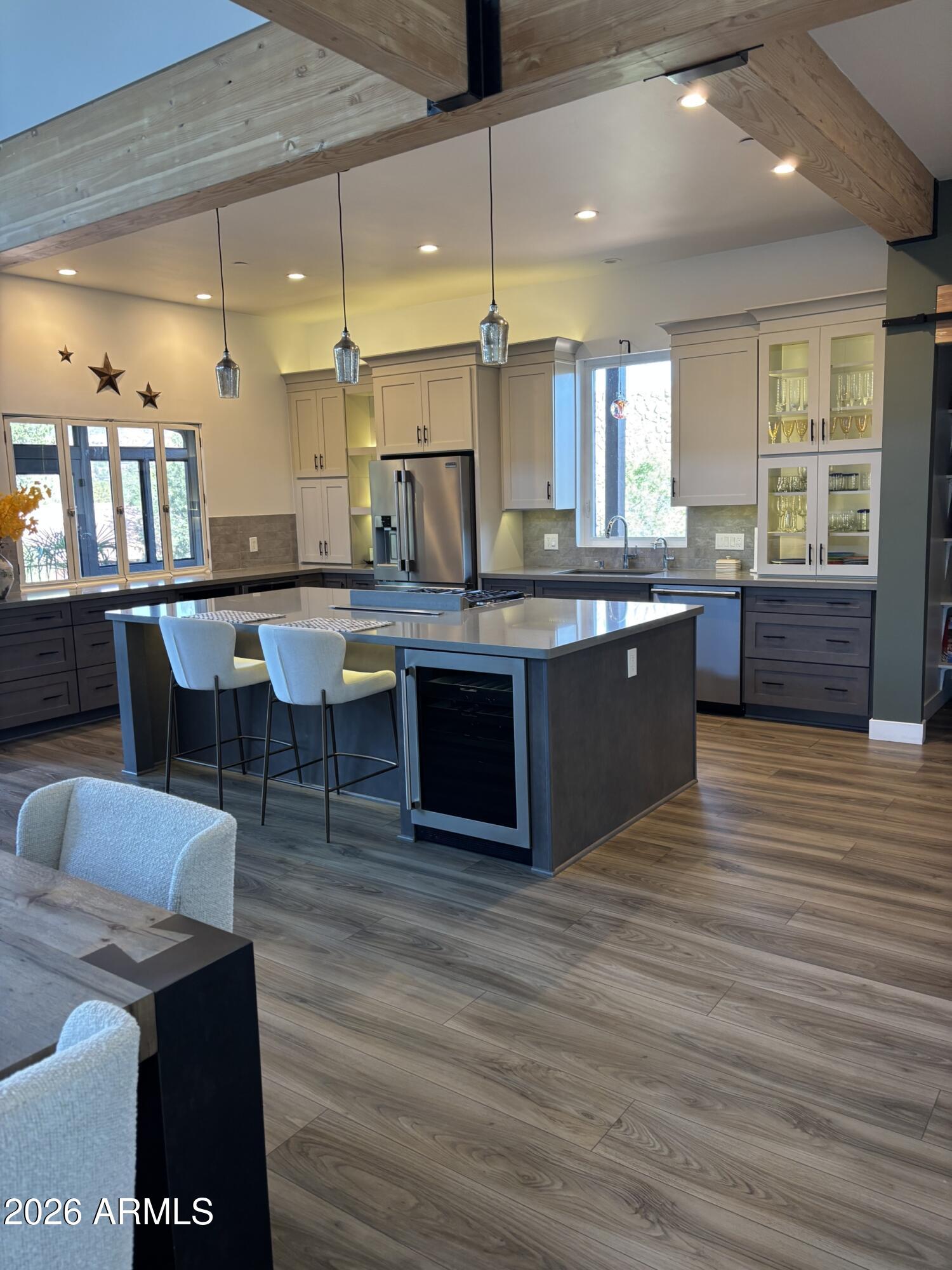 10 Granada Road Sedona, AZ 86336 - Photo 12 of 28 a large kitchen with kitchen island a sink table and chairs
