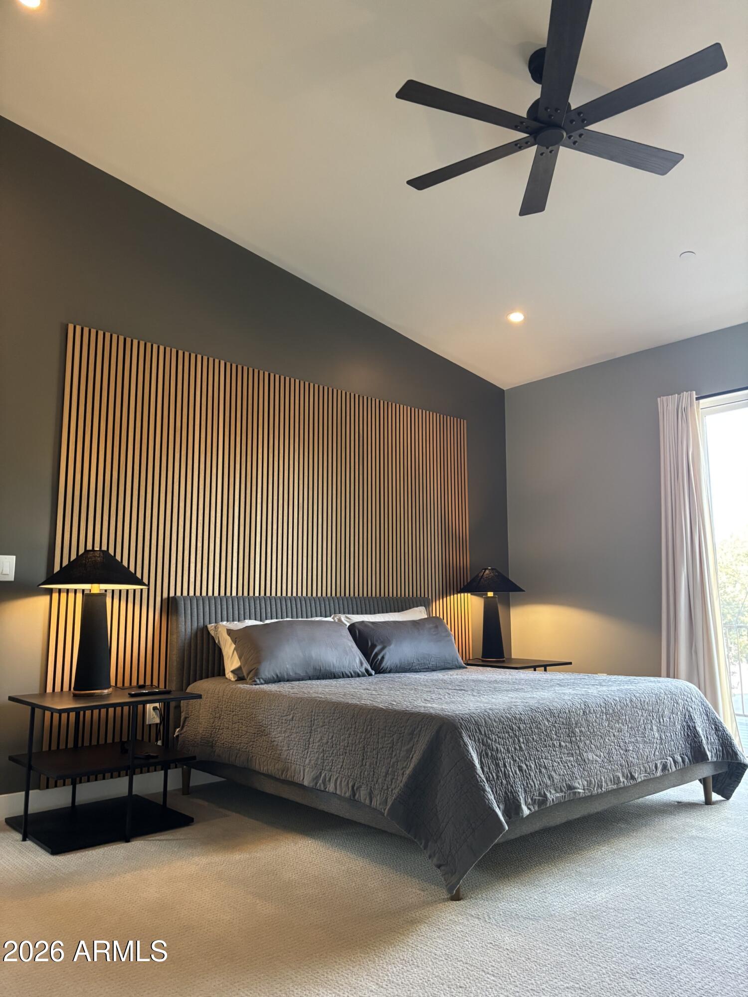 10 Granada Road Sedona, AZ 86336 - Photo 25 of 28 a bedroom with a bed and a chandelier