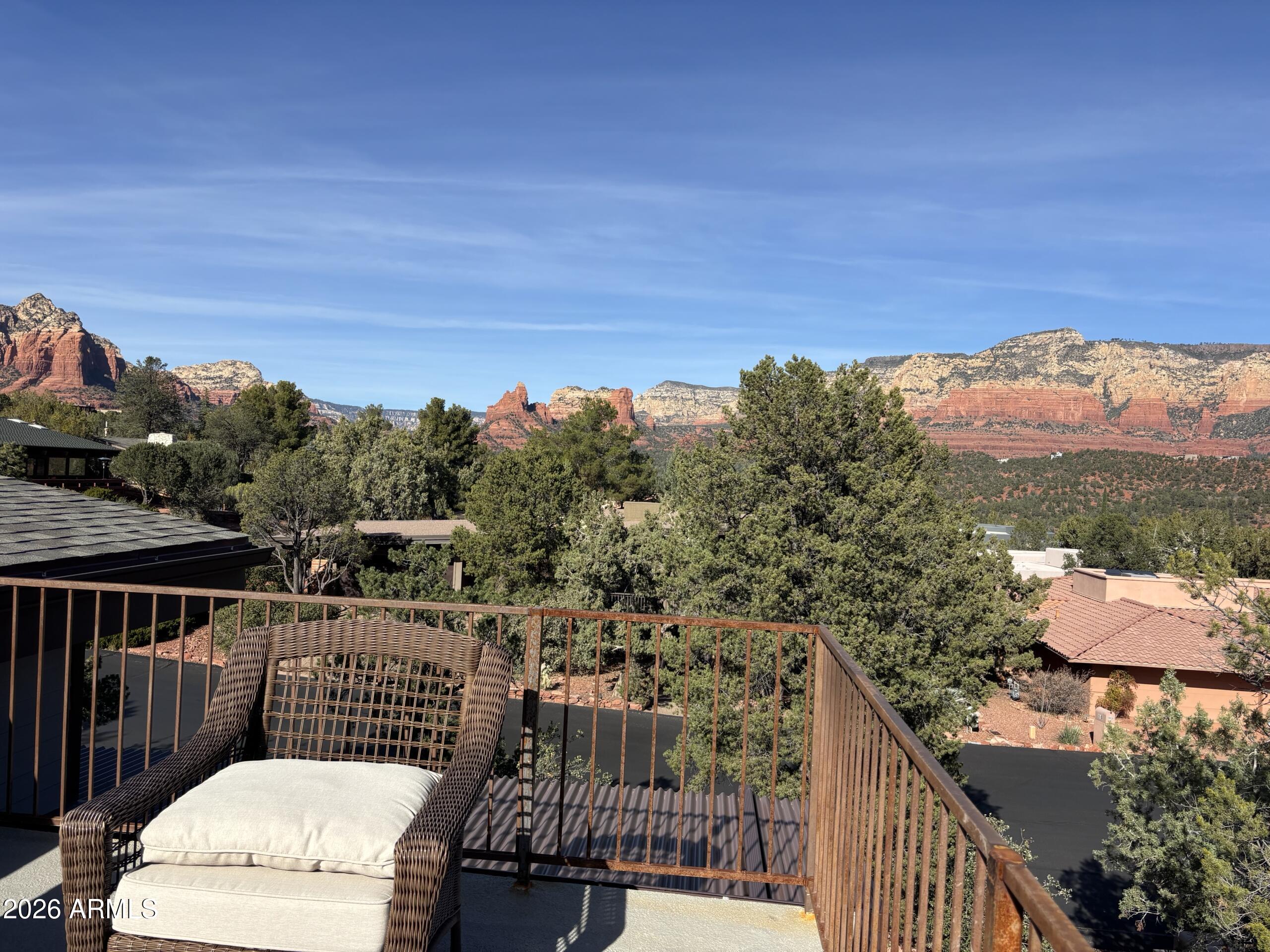 10 Granada Road Sedona, AZ 86336 - Photo 6 of 28 a view of a balcony with wooden floor and fence