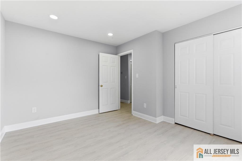 809 Woodbridge Commons Way, Unit 809 Iselin, NJ 08830 - Photo 13 of 16 a view of an empty room