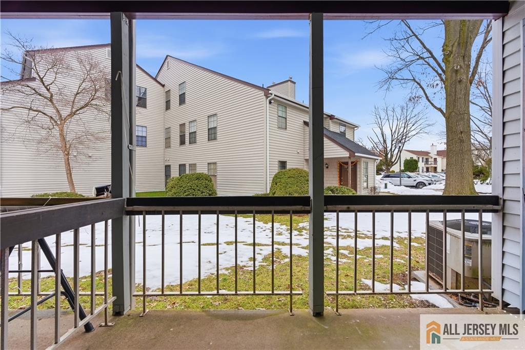 809 Woodbridge Commons Way, Unit 809 Iselin, NJ 08830 - Photo 16 of 16 a view of a building from a balcony