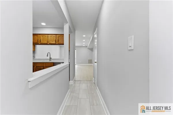 a bathroom with a bathtub and a sink