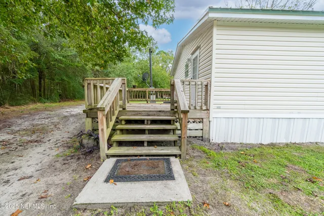 a view of a backyard with stairs