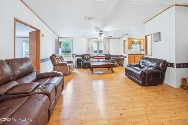 a living room with furniture window and a table