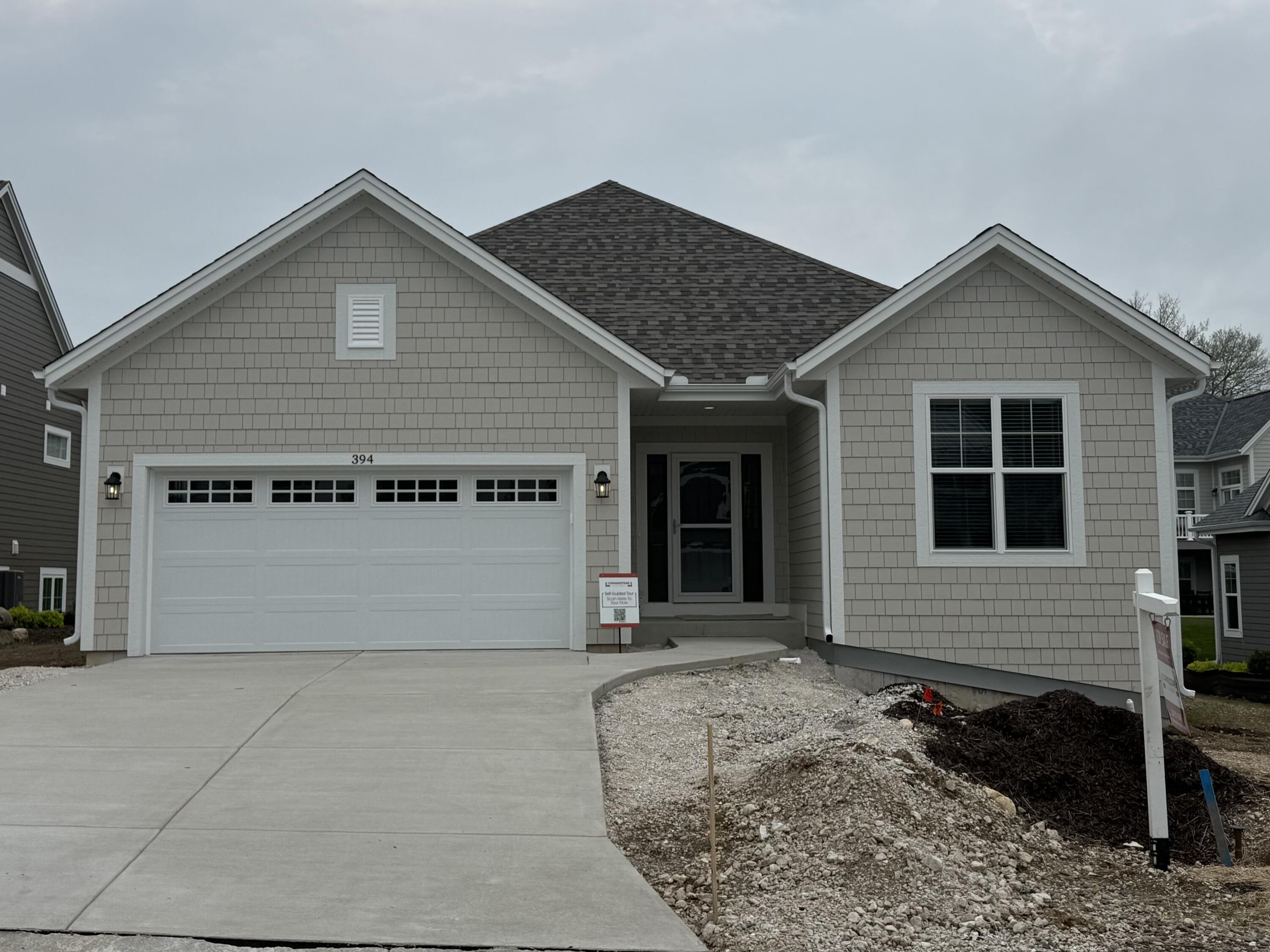394 Sandy Circle Pewaukee, WI 53072 - Photo 1 of 31 Holly Front of Home