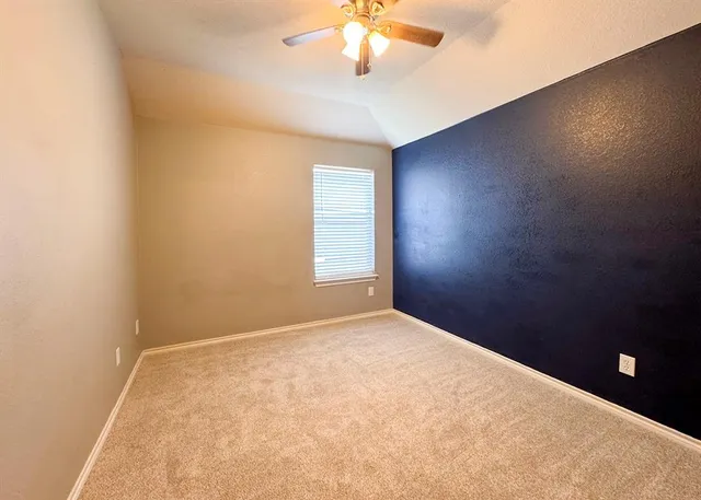 a view of a house with a backyard and a patio