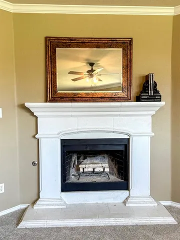 a living room with a fireplace and a wooden floor