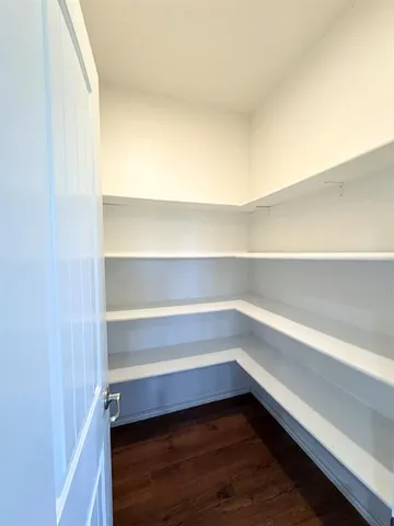 a storage room with wooden floor