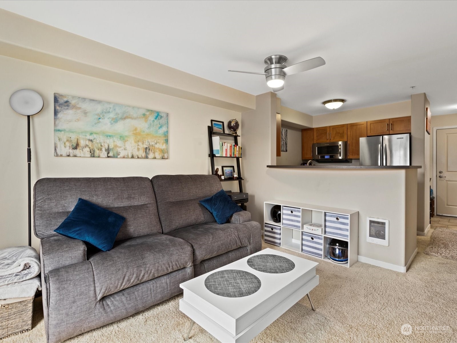3015 Southwest Avalon Way, Unit 407 Seattle, WA 98126 - Photo 15 of 27 a living room with furniture and a fireplace