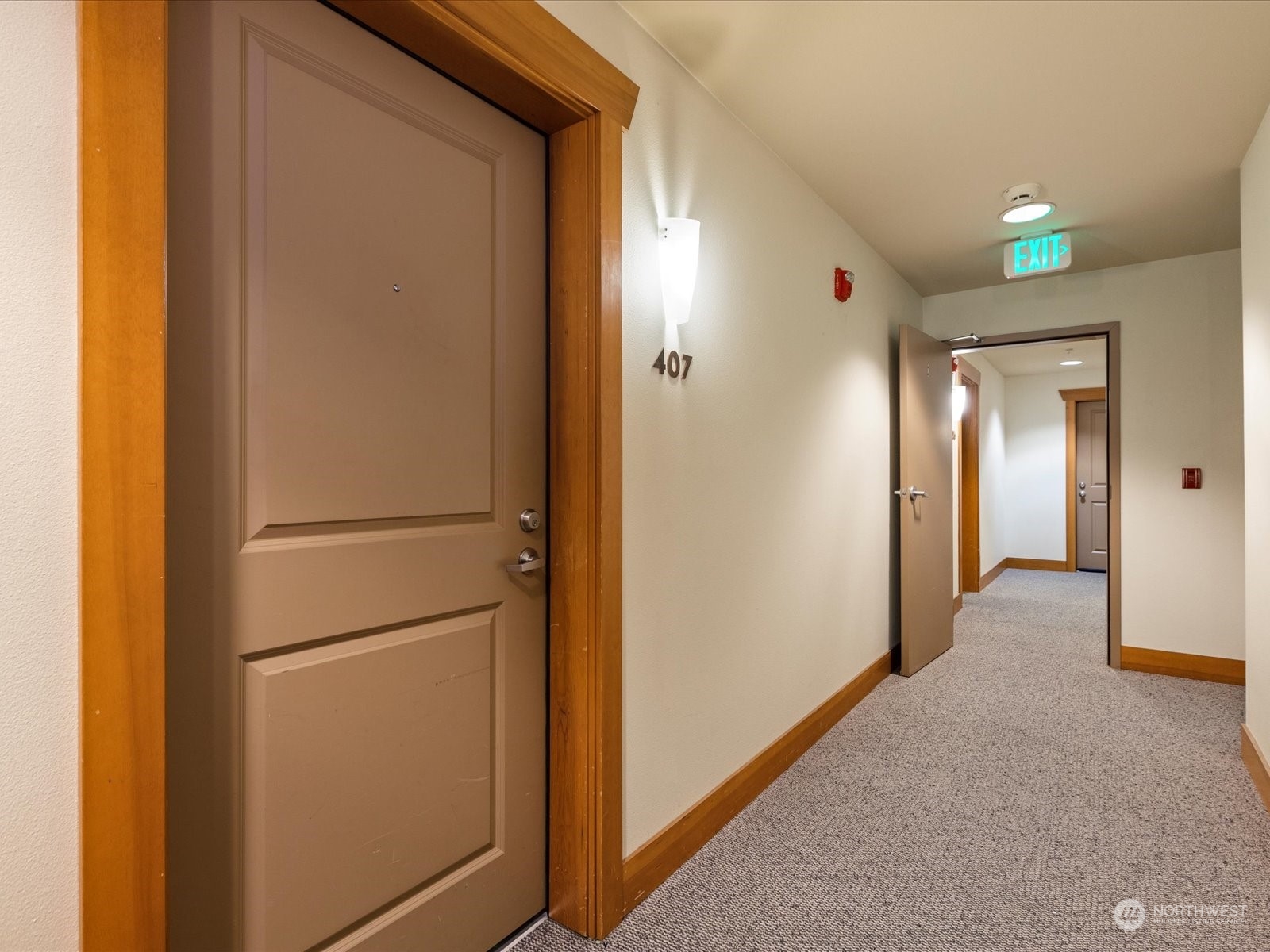 3015 Southwest Avalon Way, Unit 407 Seattle, WA 98126 - Photo 19 of 27 a view of a hallway with some storage and utility room