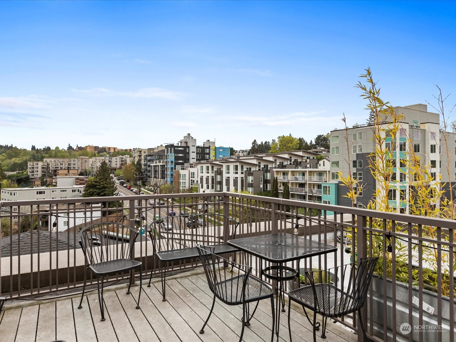 3015 Southwest Avalon Way, Unit 407 Seattle, WA 98126 - Photo 20 of 27 a view of a balcony with wooden floor and city view