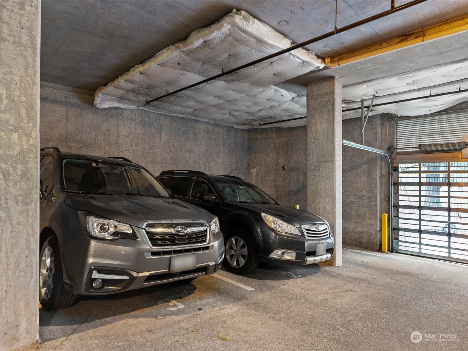 3015 Southwest Avalon Way, Unit 407 Seattle, WA 98126 - Photo 24 of 27 a car parked in a garage