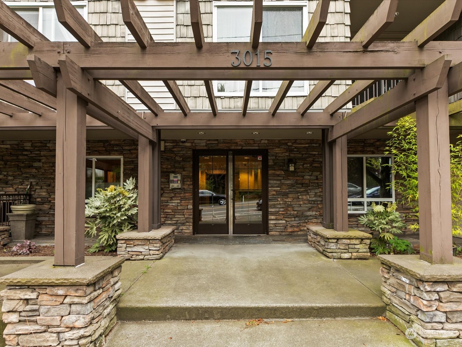 3015 Southwest Avalon Way, Unit 407 Seattle, WA 98126 - Photo 27 of 27 a view of a room with wooden walls and windows