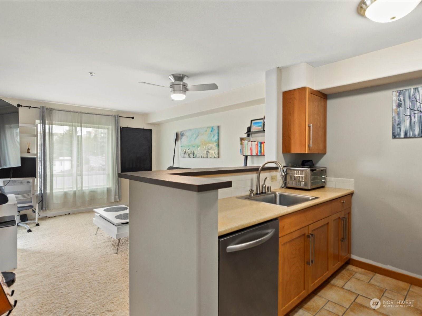 3015 Southwest Avalon Way, Unit 407 Seattle, WA 98126 - Photo 10 of 27 a kitchen with a sink stove and refrigerator