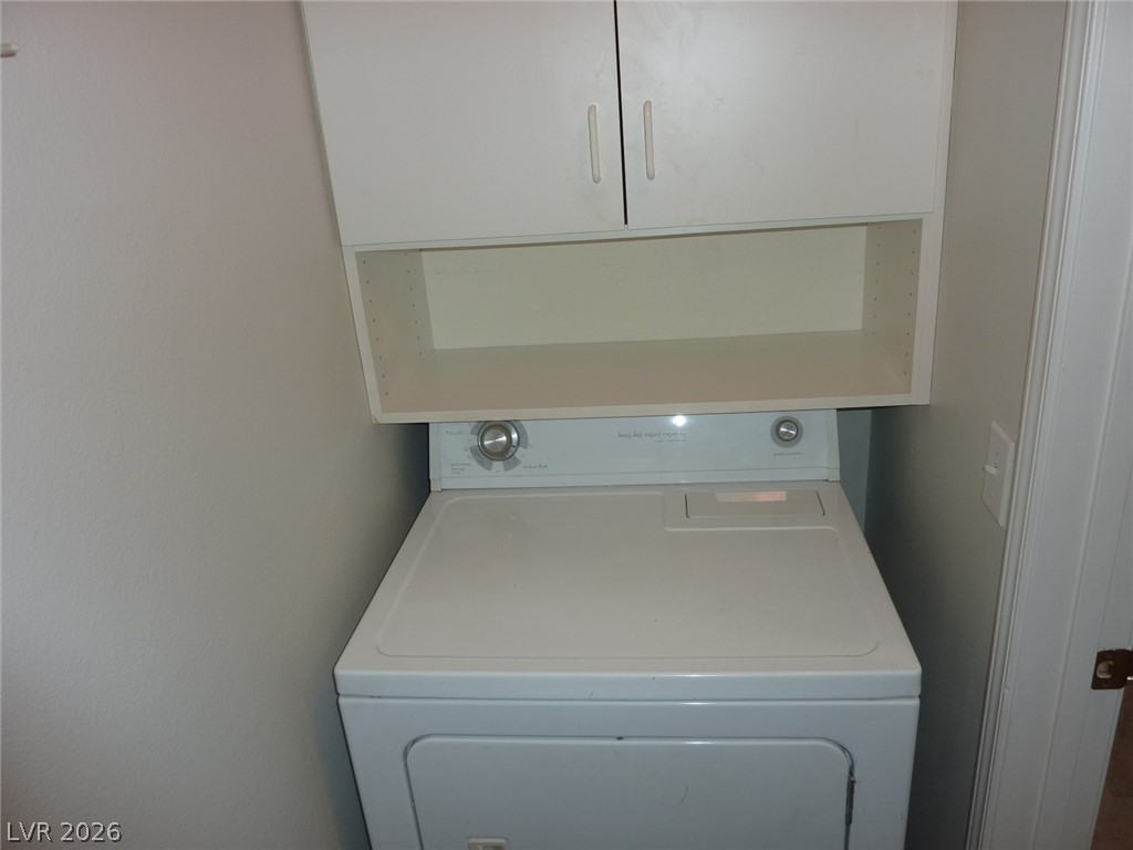 8555 West Russell Road, Unit 2094 Las Vegas, NV 89113 - Photo 24 of 31 Laundry area with washer / dryer and cabinet space