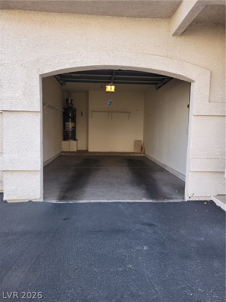 8555 West Russell Road, Unit 2094 Las Vegas, NV 89113 - Photo 25 of 31 1 car Garage with water heater