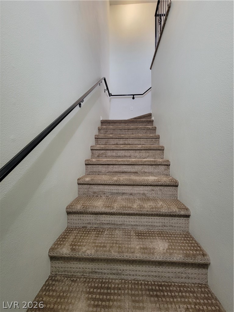 8555 West Russell Road, Unit 2094 Las Vegas, NV 89113 - Photo 3 of 31 View of stairway going up to unit from garage