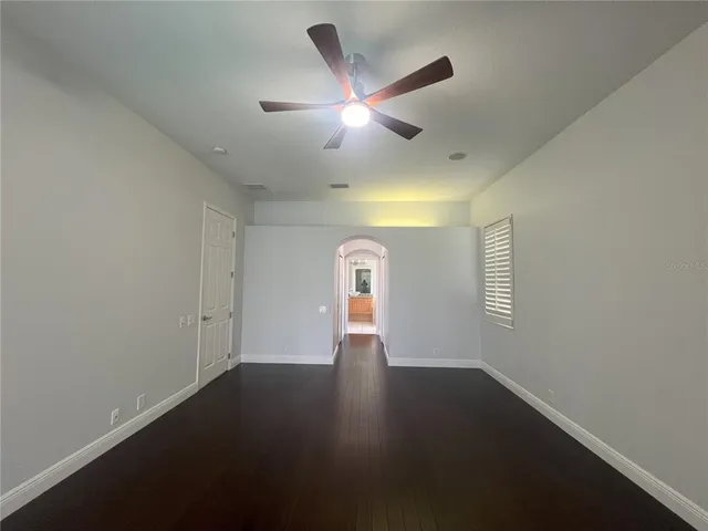 a bathroom with a granite countertop tub sink and mirror