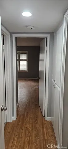 a view of hallway with a front door and mirror