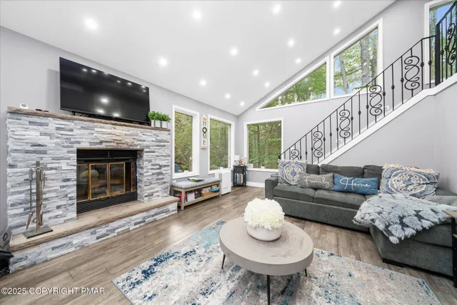 a living room with furniture and a flat screen tv
